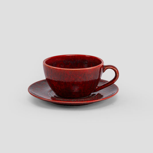 Homura red porcelain cup and matched saucer
