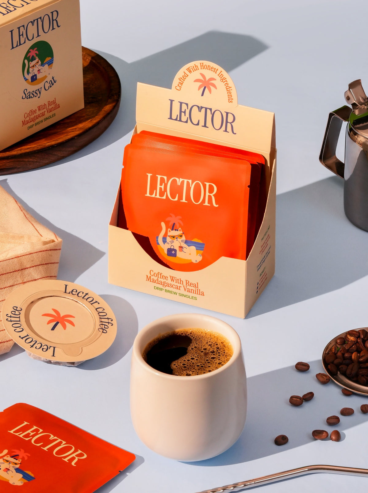 The Sassy Cat drip brew coffee box — coffee on grey-blue steps